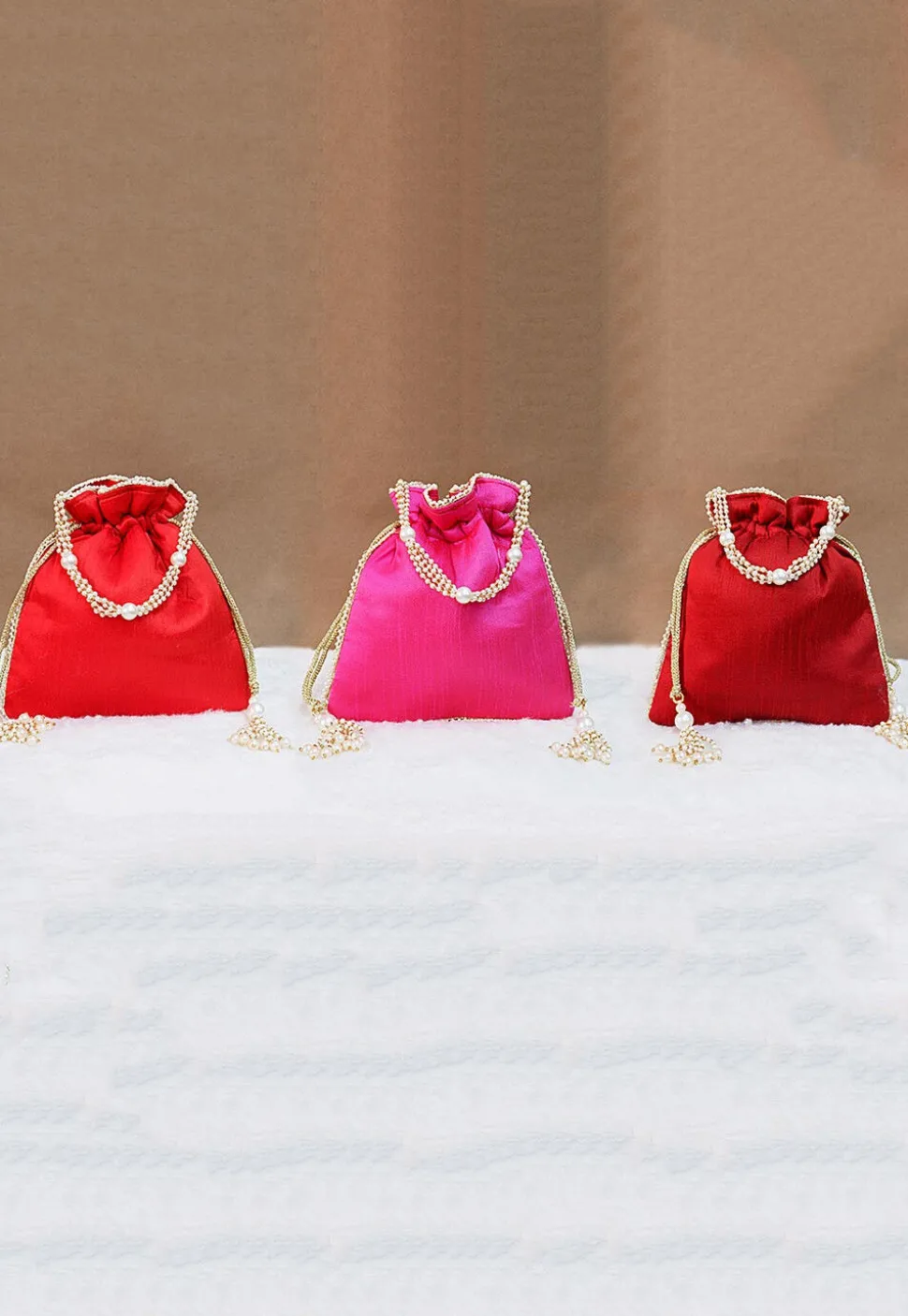 Combo Hand Embroidered Art Silk Potli Bag in Red and Pink