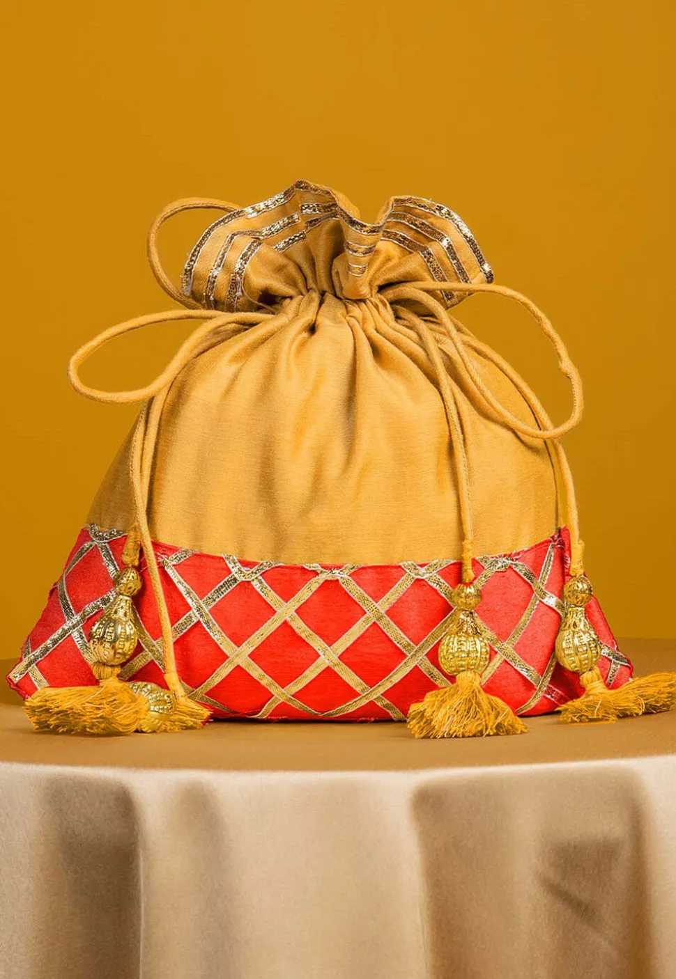 Embellished Art Silk Potli Bag in Yellow and Orange