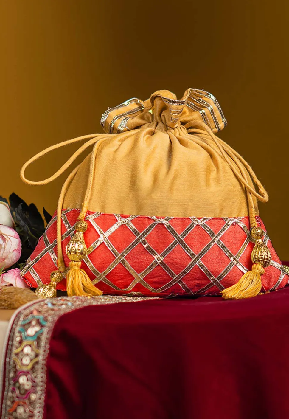 Embellished Art Silk Potli Bag in Yellow and Orange
