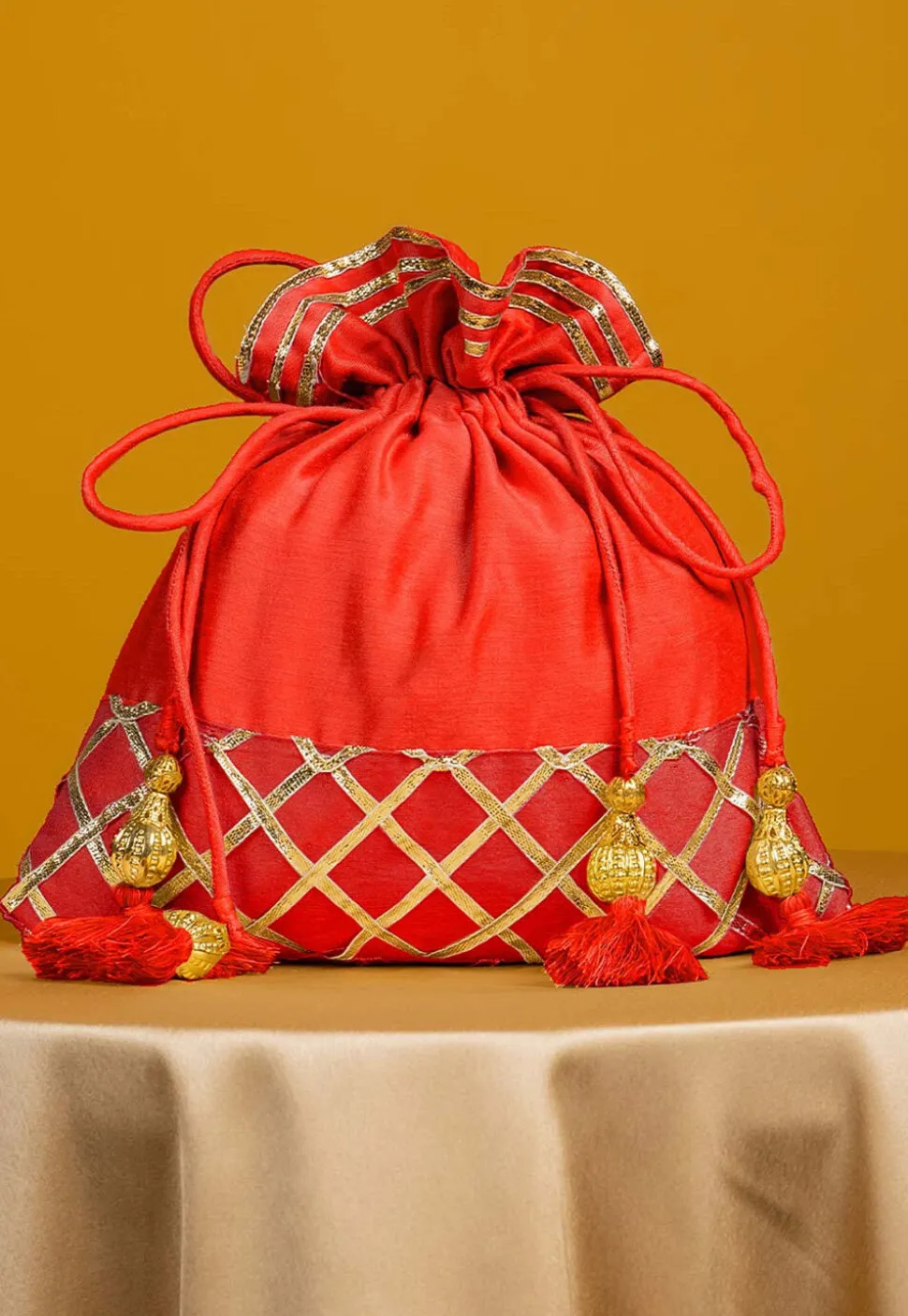 Embellished Art Silk Potli Bag in Orange