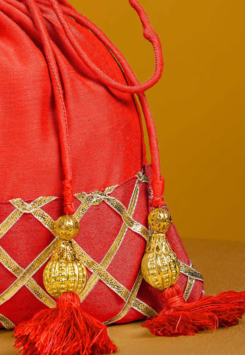 Embellished Art Silk Potli Bag in Orange