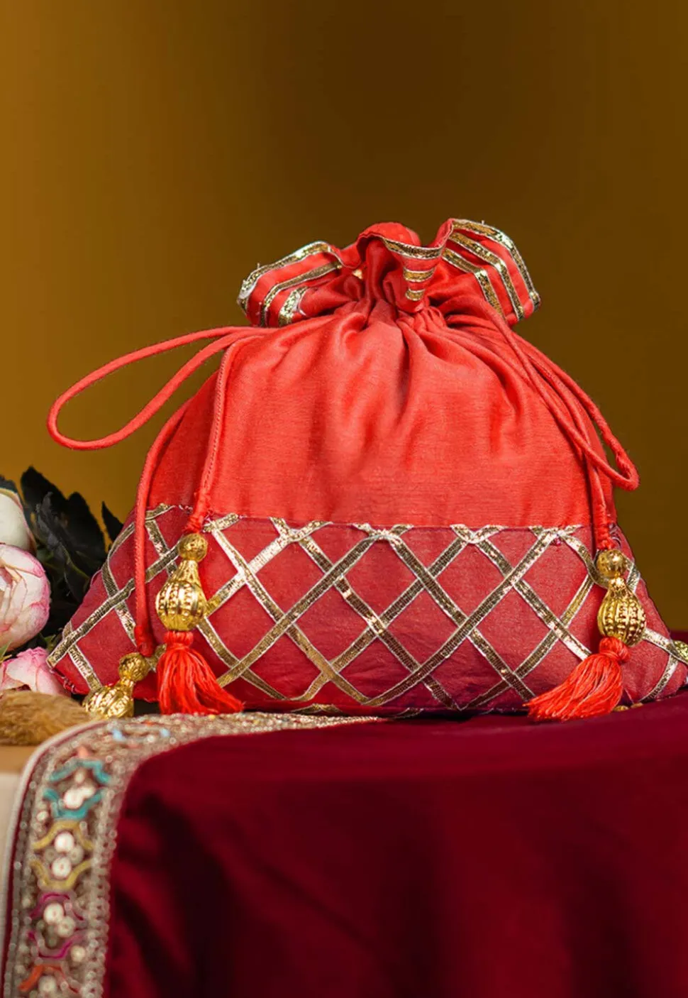 Embellished Art Silk Potli Bag in Orange