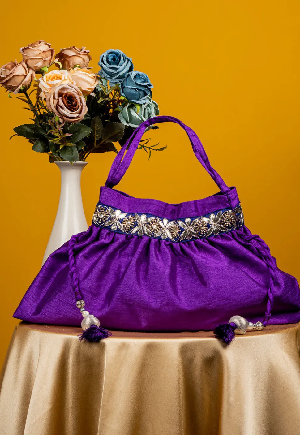 Embroidered Art Silk Potli Bag in Purple