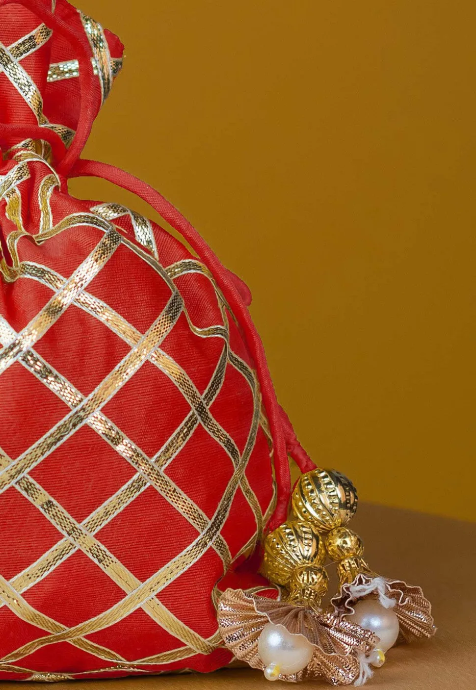 Embroidered Art Silk Potli Bag in Red