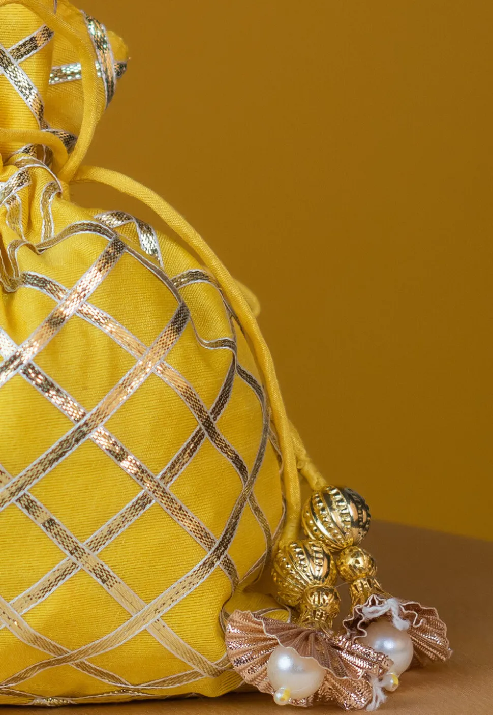 Embroidered Art Silk Potli Bag in Yellow
