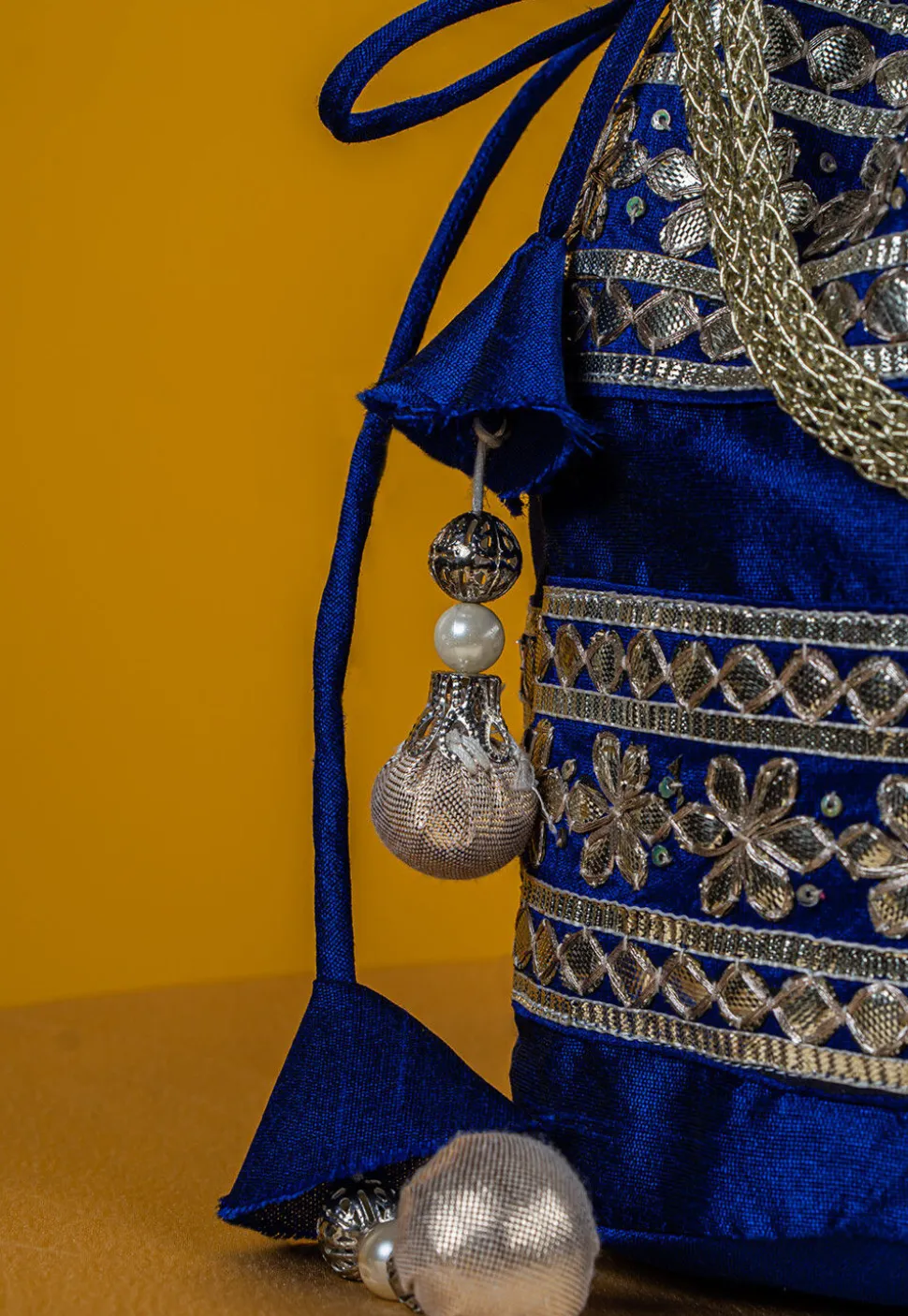 Embroidered Art Silk Potli Bag in Royal Blue
