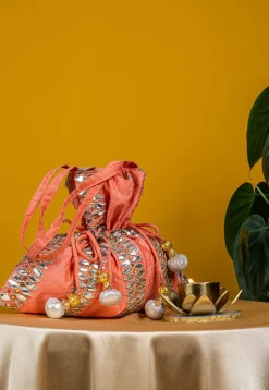 Embroidered Art Silk Potli Bag in Peach