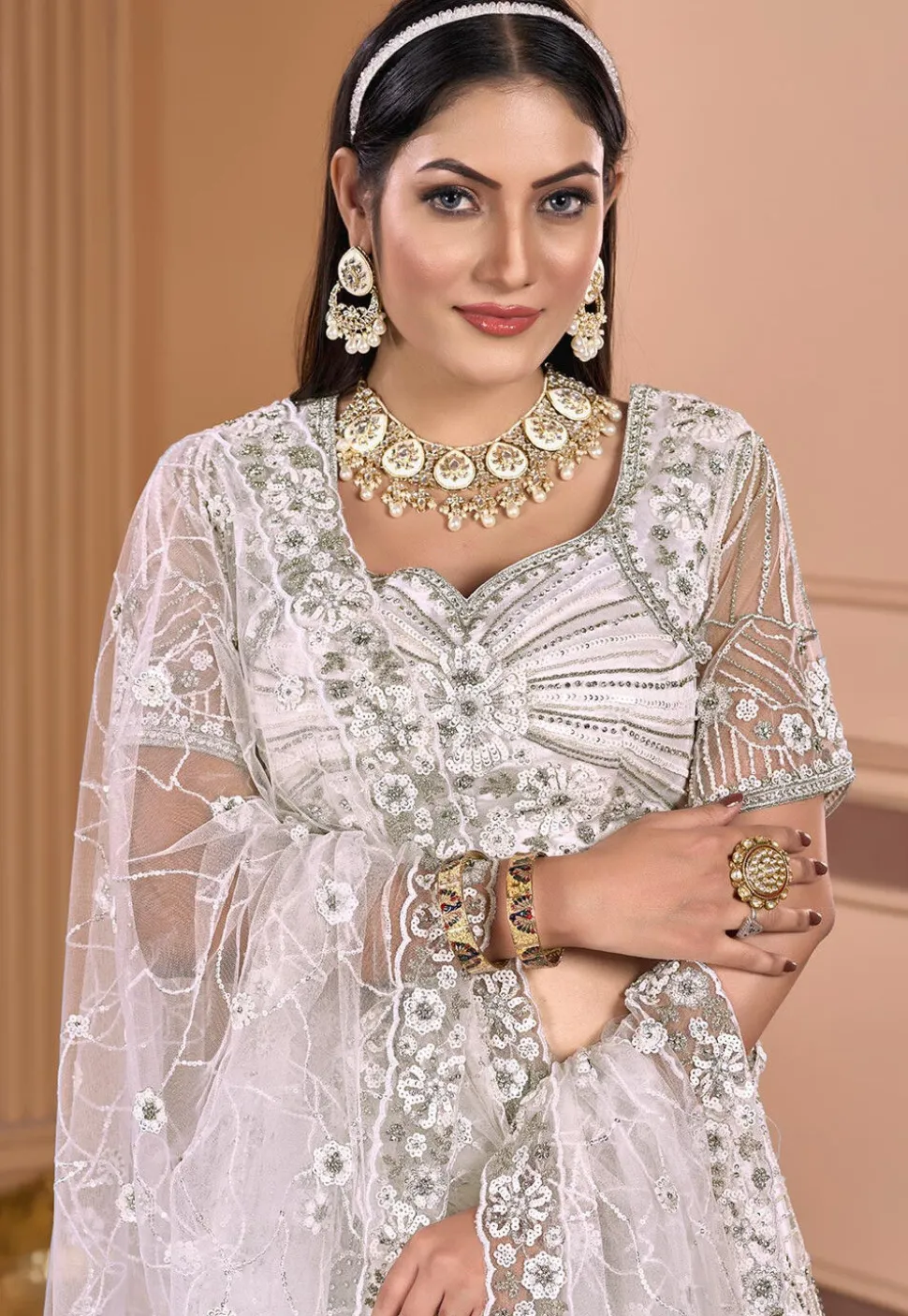 Embroidered Net Lehenga in Off White