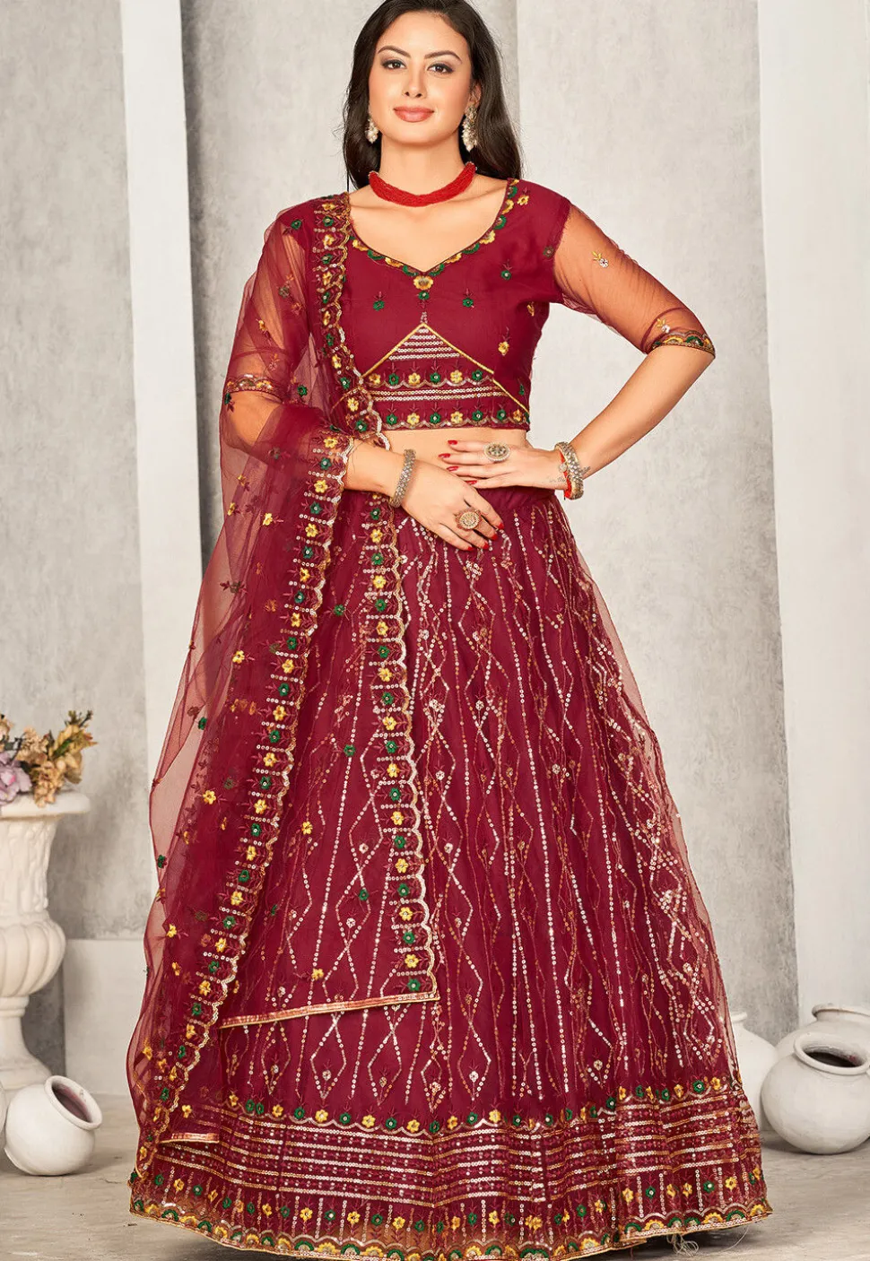 Embroidered Net Lehenga in Maroon