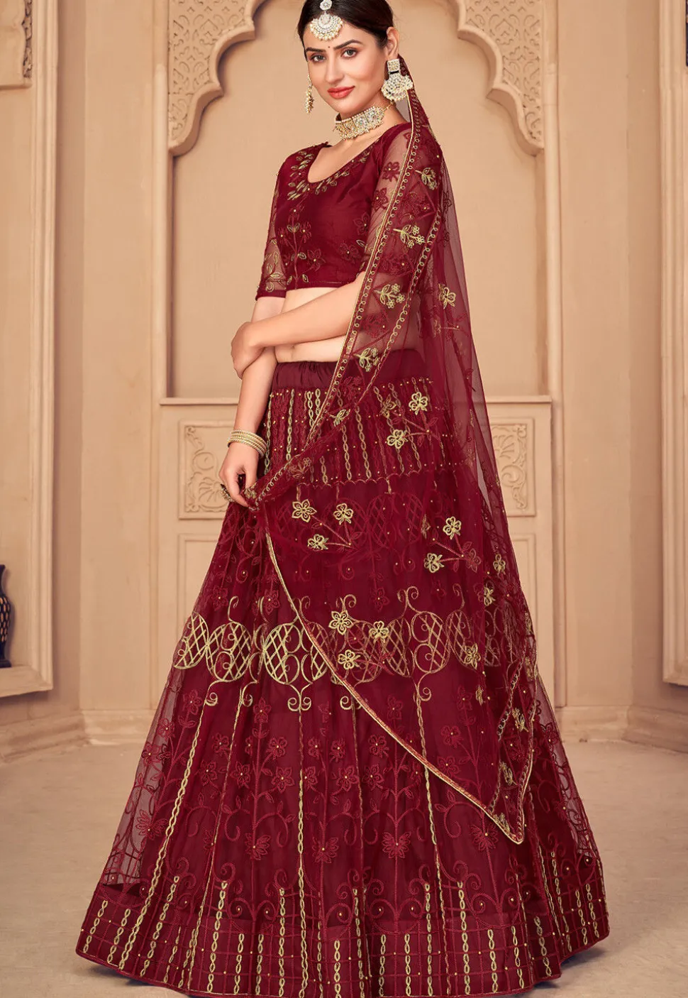 Embroidered Net Lehenga in Maroon
