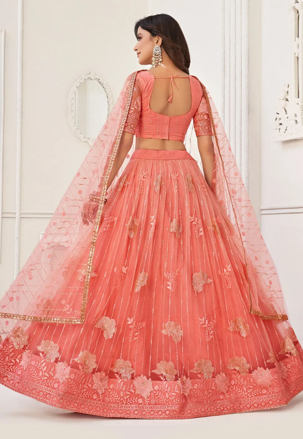 Embroidered Net Lehenga in Peach