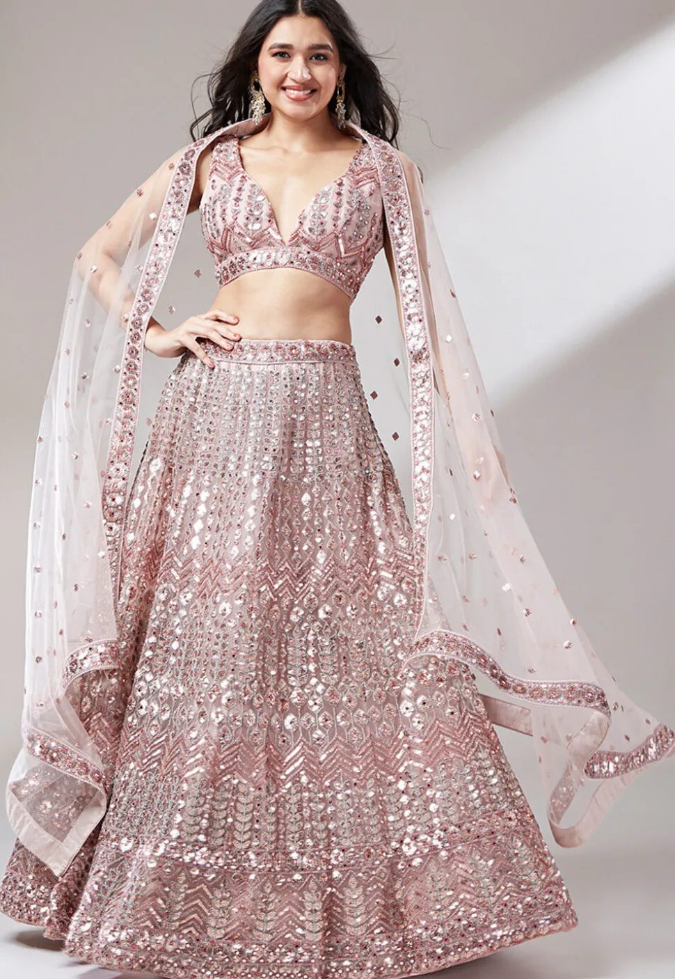 Embroidered Net Lehenga in Peach