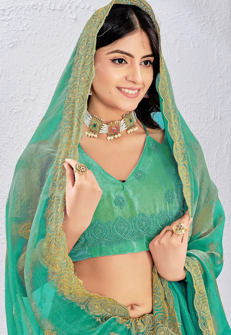 Embroidered Tissue Silk Saree in Teal Green