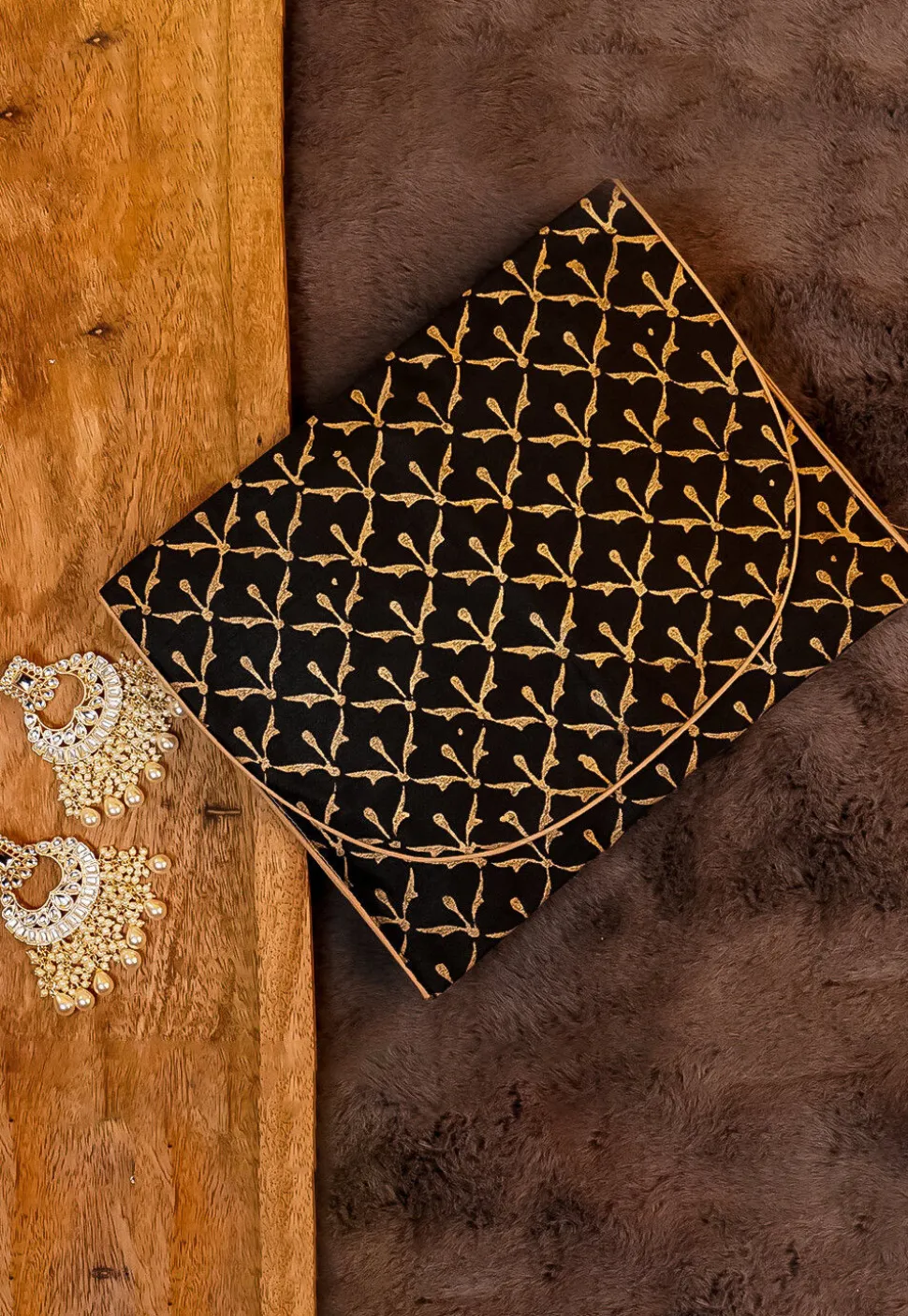Golden Printed Art Silk Clutch Bag in Black