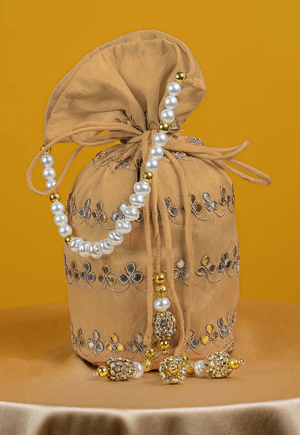 Gota Patti Art Silk Potli Bag in Beige