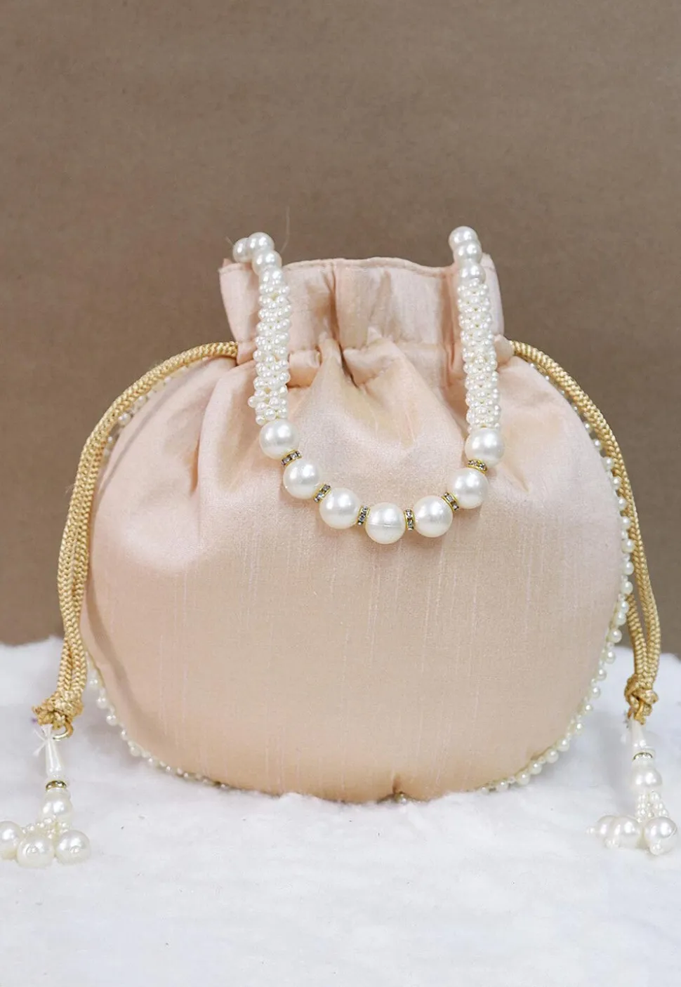 Hand Embroidered Art Silk Potli Bag in Light Beige