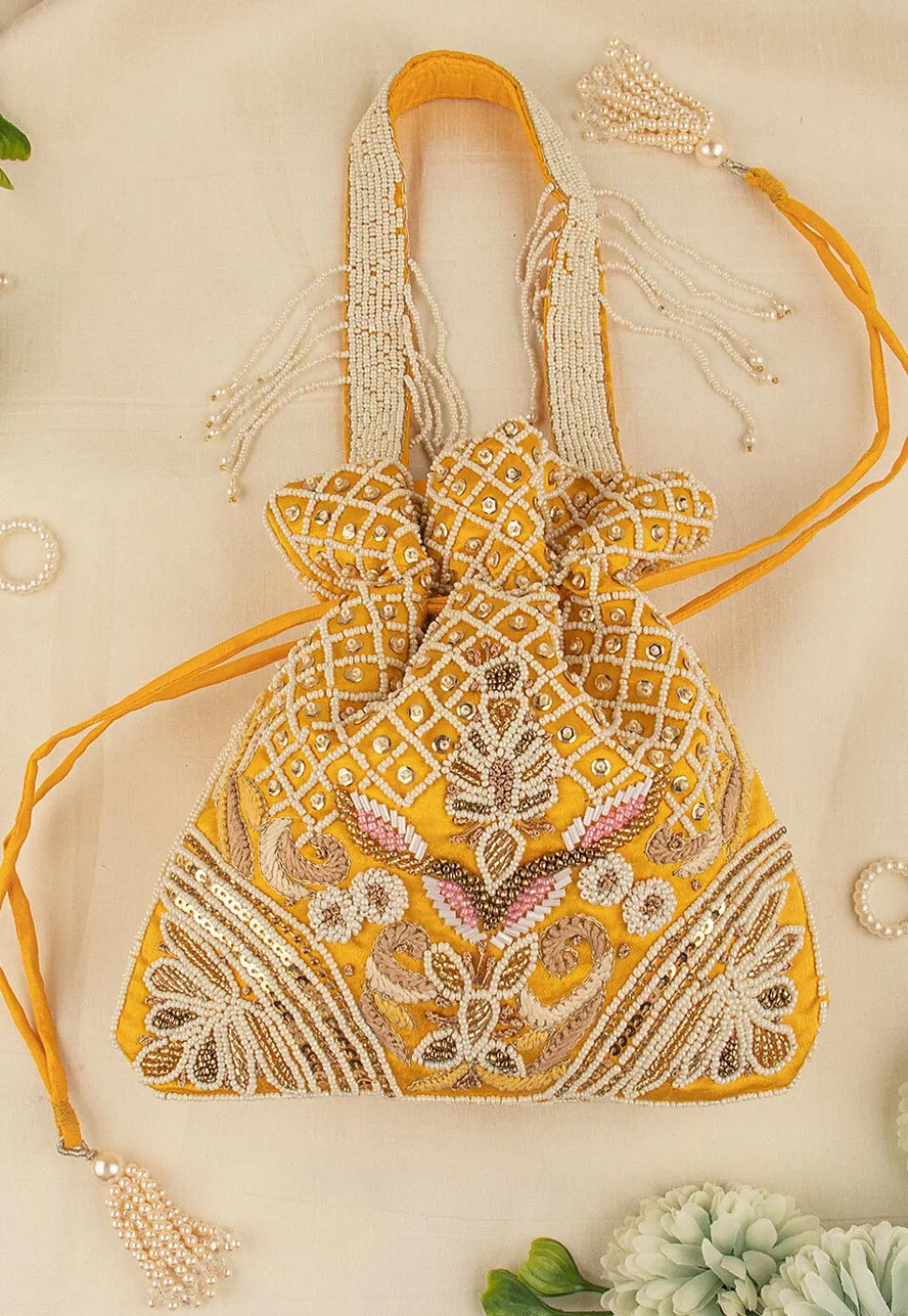 Hand Embroidered Art Silk Potli Bag in Mustard