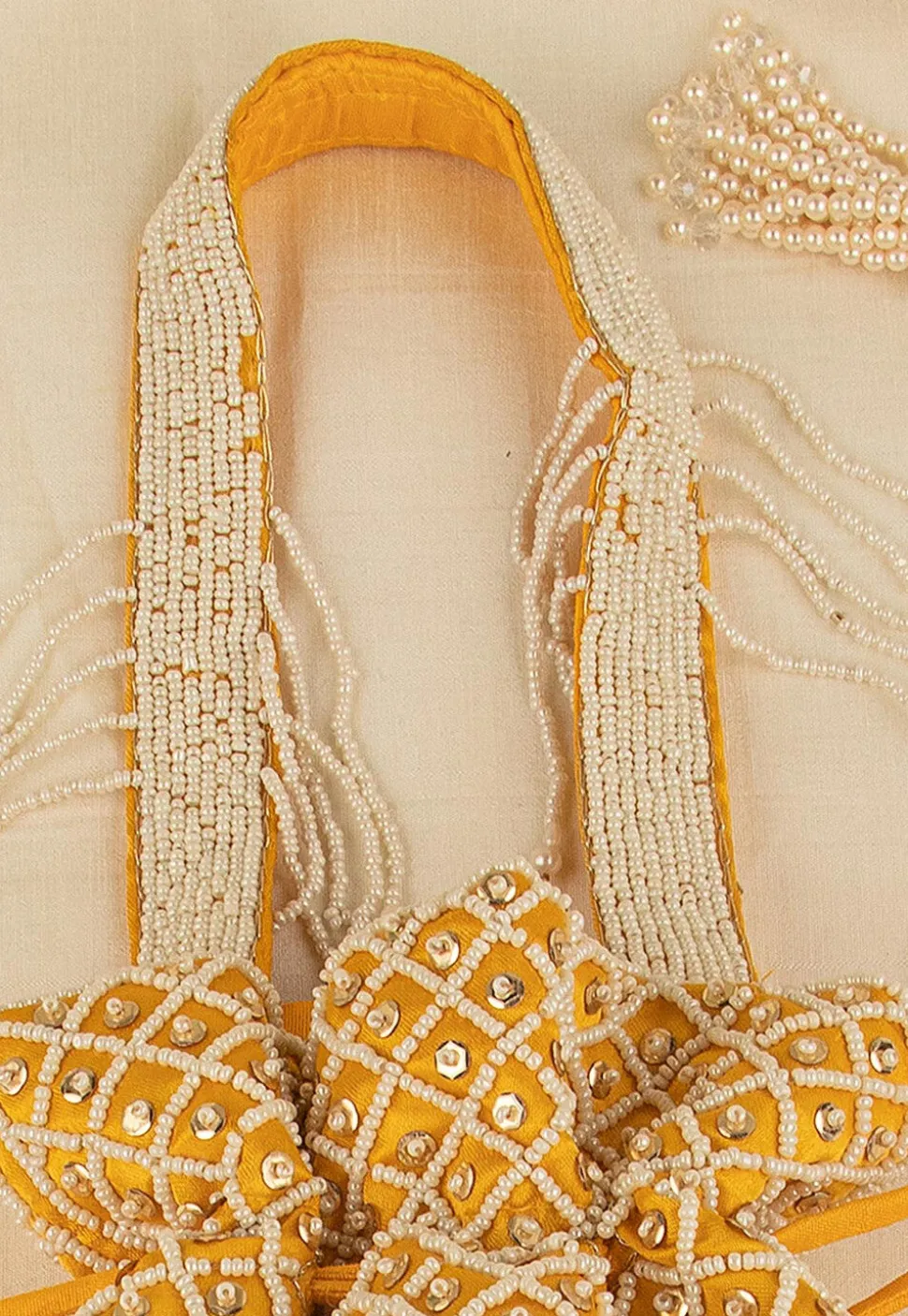 Hand Embroidered Art Silk Potli Bag in Mustard