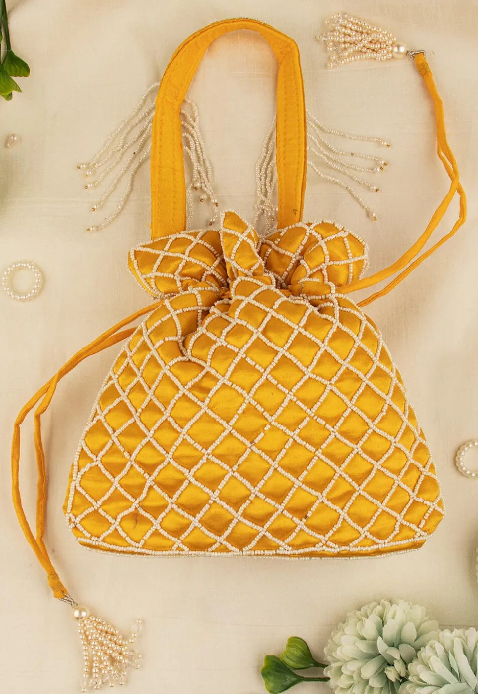 Hand Embroidered Art Silk Potli Bag in Mustard