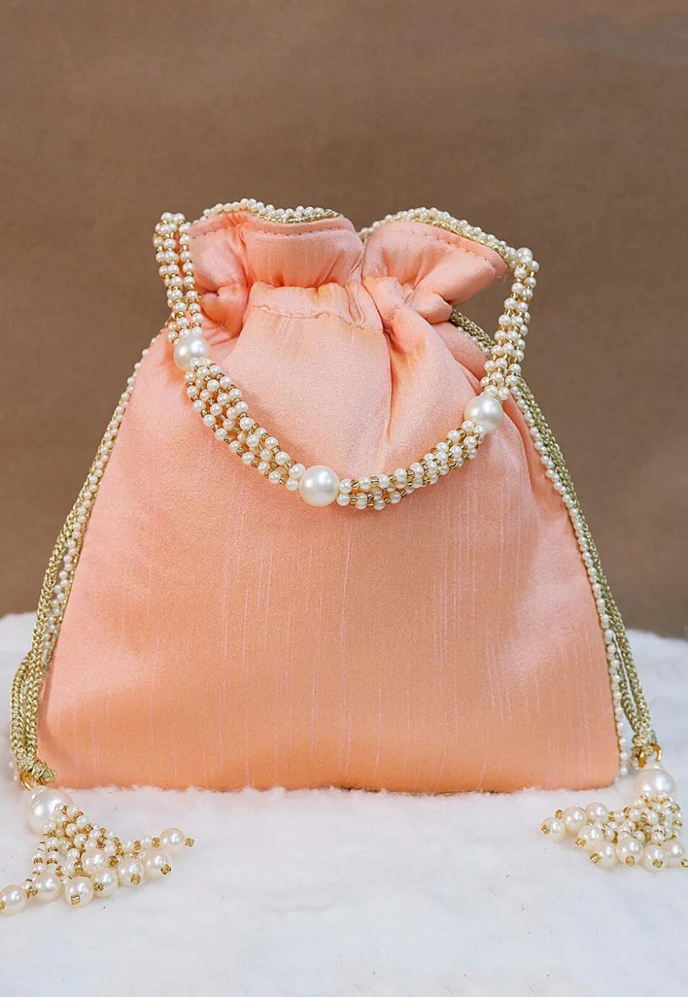 Hand Embroidered Art Silk Potli Bag in Peach