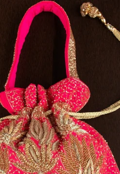 Hand Embroidered Art Silk Potli Bag in Fuchsia