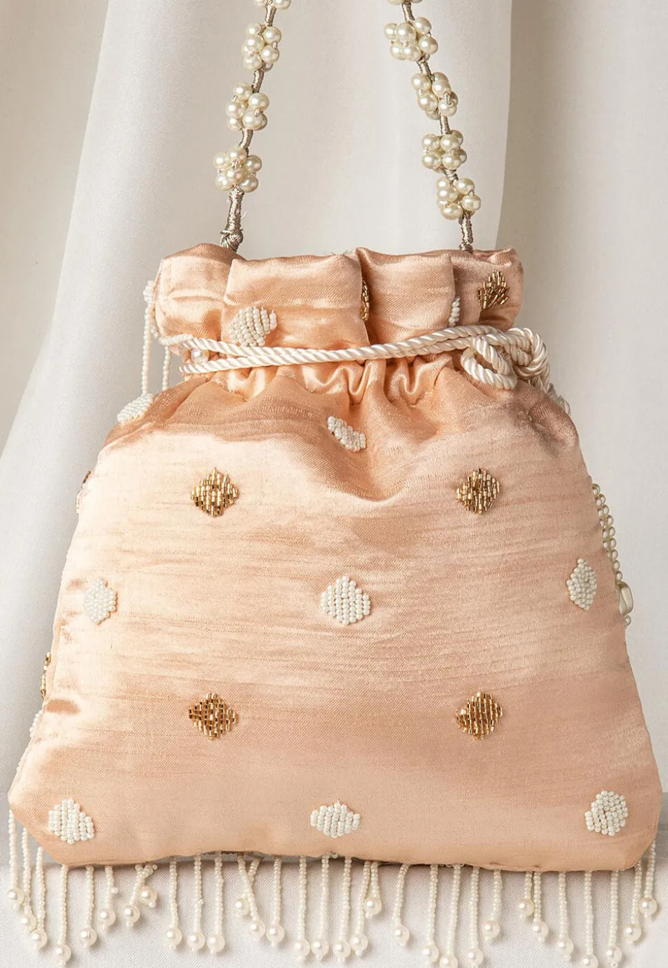Hand Embroidered Art Silk Potli Bag in Rose Gold