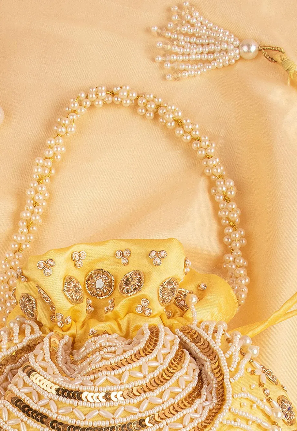Hand Embroidered Art Silk Potli Bag in Pastel Yellow