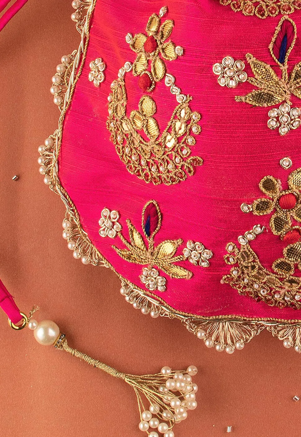 Hand Embroidered Art Silk Potli Bag in Fuchsia