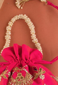Hand Embroidered Art Silk Potli Bag in Fuchsia