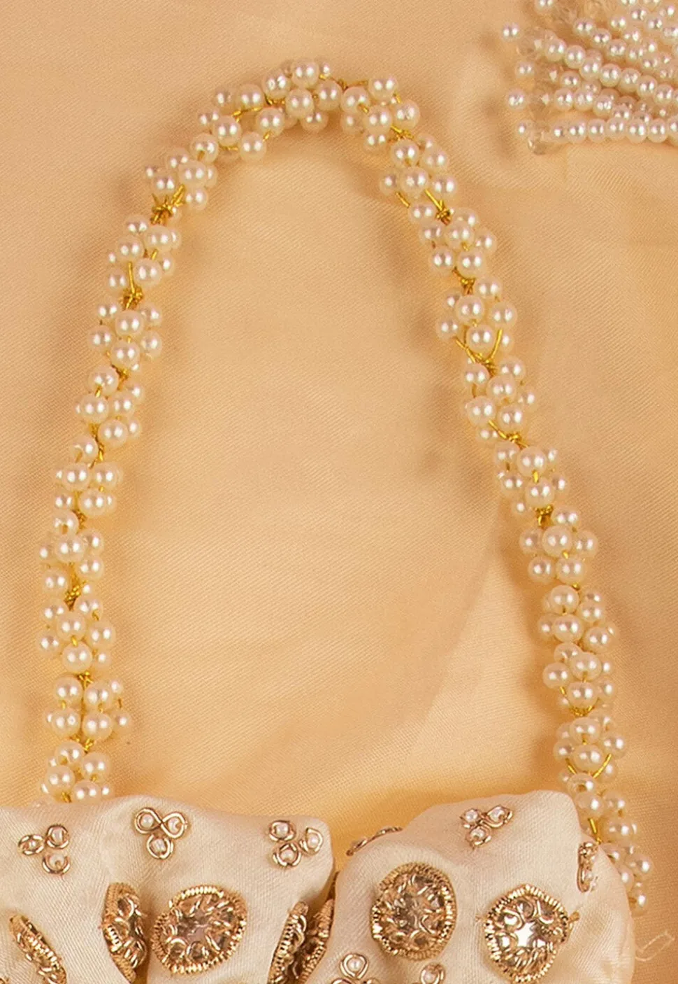 Hand Embroidered Art Silk Potli Bag in Beige