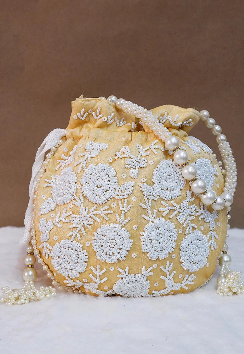 Hand Embroidered Art Silk Potli Bag in Light Beige