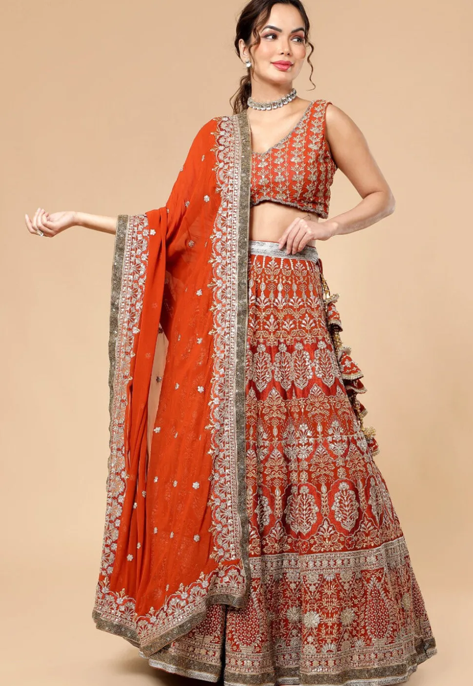 Hand Embroidered Viscose Georgette Lehenga in Rust