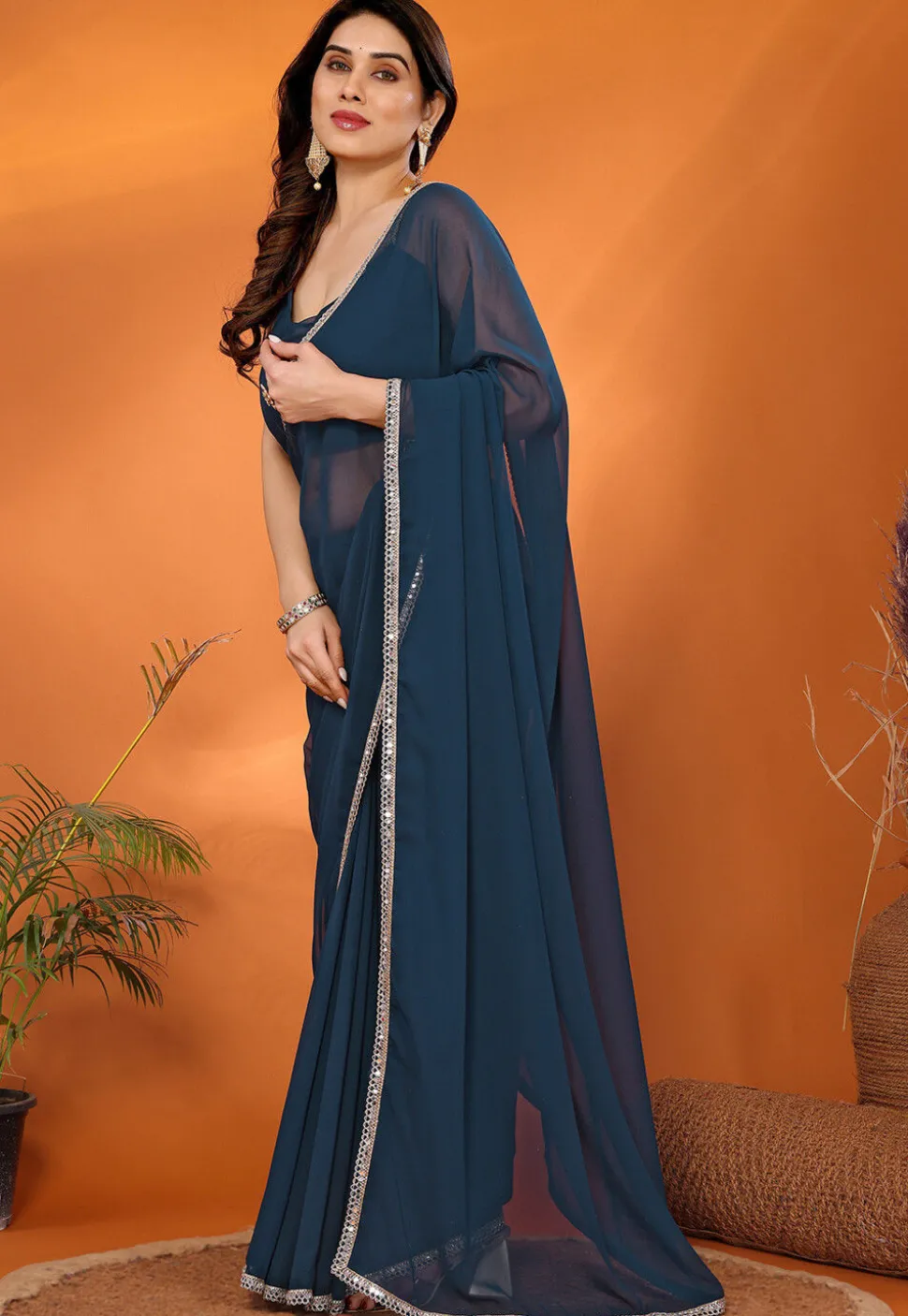 Lace Embellished Georgette Saree in Teal Blue