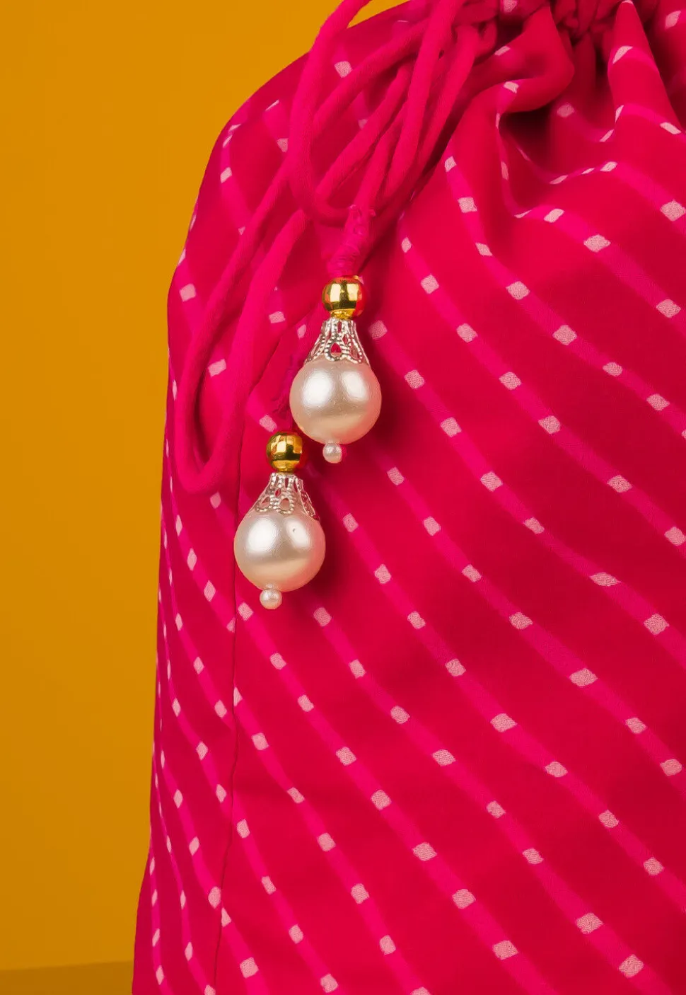Leheriya Printed Georgette Potli Bag in Fuchsia