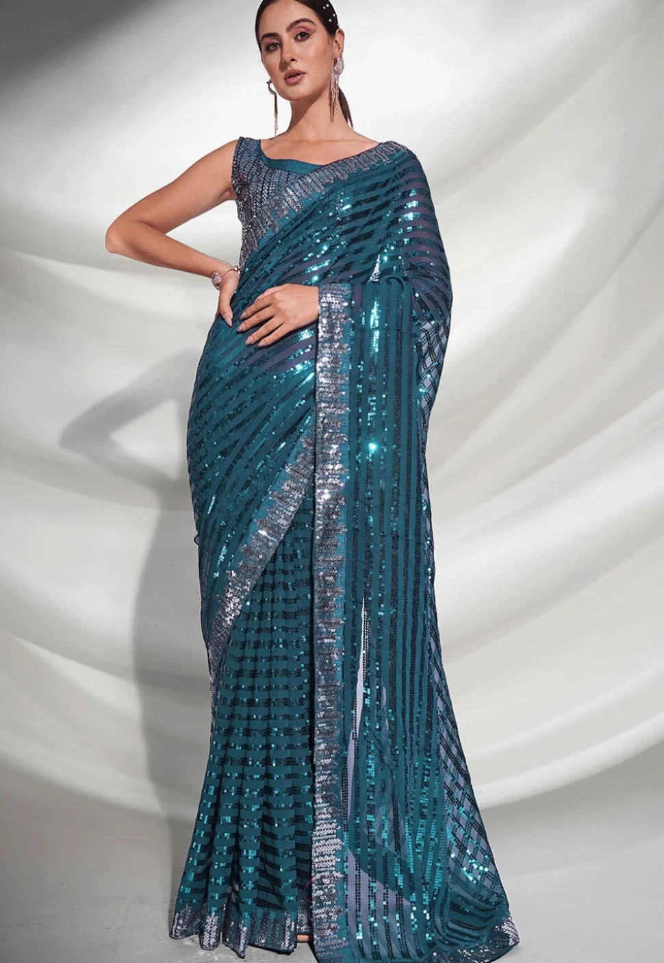Sequinned Georgette Saree in Teal Blue